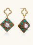 Gold quatrefoil stud earrings with ornate square pendants featuring turquoise stones and freshwater pearls