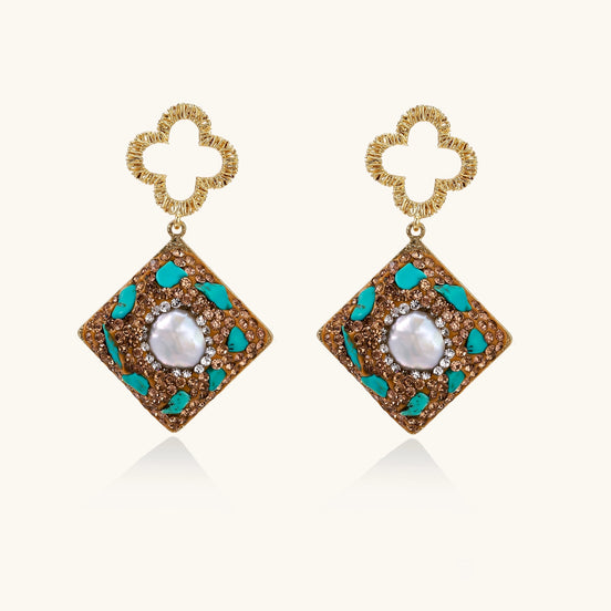 Gold quatrefoil stud earrings with ornate square pendants featuring turquoise stones and freshwater pearls