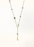 Long gold-plated necklace with alternating white and gray freshwater pearls spaced along delicate chain segments