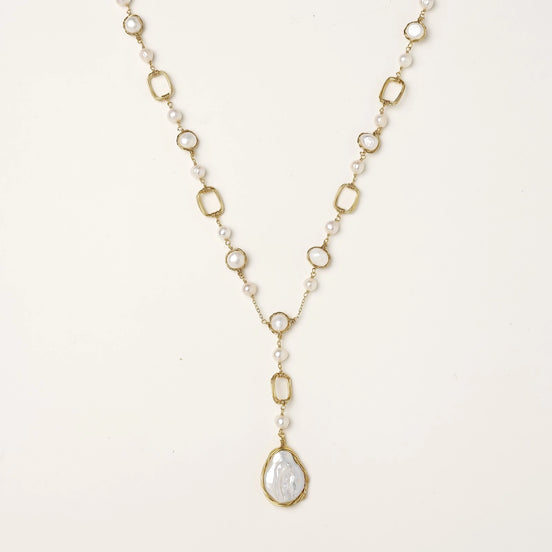 Y-shaped gold-plated necklace with freshwater pearls and geometric elements, featuring a baroque pearl pendant drop
