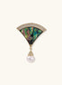 Art Deco fan-shaped pin with iridescent abalone shell, gold setting with crystals, and freshwater pearl drop.