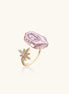 Adjustable ring with lavender baroque pearl and crystal star charm on gold-plated band against cream background.
