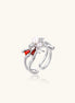 Gold-plated adjustable ring featuring spider design with white pearl, red enamel accents, and central zirconia stone
