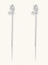 Long gold-plated earrings with star motifs and delicate chain tassels cascading down, featuring zirconia accents.