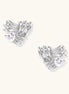 Gold-plated brass stud earrings with intricate twisted knot design and sparkling zirconia stones on neutral background.
