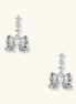 Delicate gold-plated bow drop earrings with three zirconia crystals and center pearl on white background.
