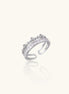 Adjustable gold-plated crown ring with zirconia crystals in ornate tiara design on white background.