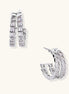Gold-plated huggie hoops featuring vertical rows of clear baguette zirconia stones in geometric linear design