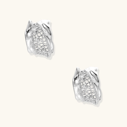 Small gold-plated brass hoop earrings with geometric lattice pattern and zirconia accents on white background.