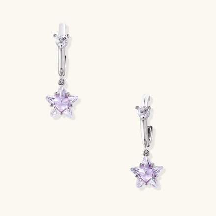 Drop earrings with purple star-shaped zirconia stones and clear teardrop accents in gold-plated brass setting