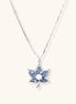 Gold-plated lotus pendant necklace with blue zirconia stones and white beads on adjustable layered chains