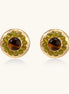 Gold-plated circular earrings featuring central tiger's eye stones surrounded by green liuli beads on textured metal base