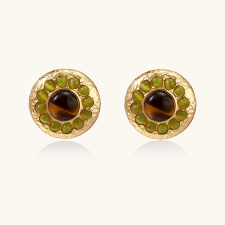 Gold-plated circular earrings featuring central tiger's eye stones surrounded by green liuli beads on textured metal base