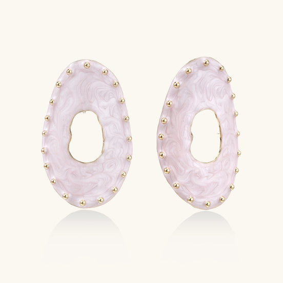 Oval lavender enamel earrings with gold studs around perimeter and cutout centers on white background