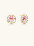 Round gold-plated stud earrings featuring pink enamel roses with freshwater pearl accents on white background.