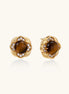 Ornate gold-plated brass stud earrings featuring round tiger's eye stones surrounded by sparkling zirconia in floral design