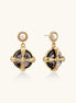 Gold-plated drop earrings with cross design framing iridescent abalone shell and pearl studs on neutral background.