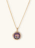 Gold-plated necklace with purple enamel pendant featuring pink floral design on white background