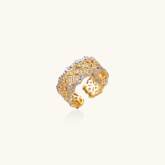 Bold geometric ring with lattice pattern in gold-plated brass featuring multiple tiers of sparkling zirconia stones