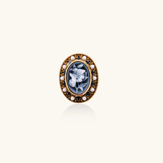 Oval cameo ring with blue-grey floral design surrounded by white shell pearls in gold-plated brass setting