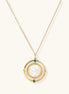 Gold-plated pendant necklace with circular orbital design, iridescent mother-of-pearl center and green zirconia accents