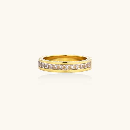 14K gold plated ring with channel-set zirconia stones and Greek key pattern engraved on sides on white background