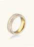 Close-up of a gold-plated eternity ring featuring two parallel rows of brilliant zirconia stones on white background.