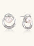 Gold-plated brass stud earrings with swirled circular design holding white freshwater pearls and small crystals