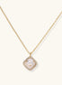 Gold-plated necklace with cushion-shaped pendant featuring a freshwater pearl surrounded by crystal halo on white background.