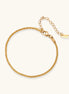 Delicate 18K gold plated stainless steel chain bracelet with textured links and adjustable extender on neutral background.