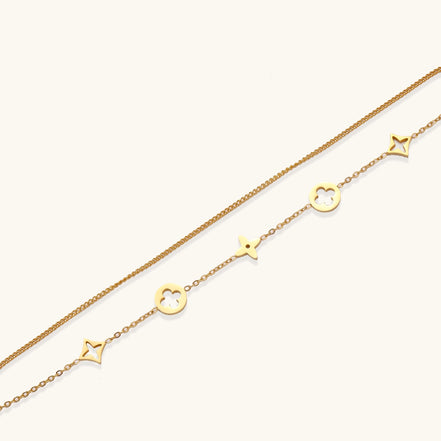 Dainty gold-plated bracelet with star and clover charms on double chain with adjustable extender