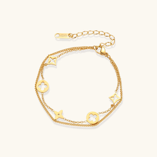 Dainty gold-plated bracelet with star and clover charms on double chain with adjustable extender