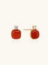 18K gold vermeil stud earrings with cushion-cut red agate stones and sparkling crystal accents on beige background