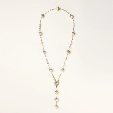 Gold-plated lariat necklace with baroque pearls and textured caps on cream background, showing adjustable Y-shaped design.