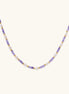Delicate 18K gold vermeil necklace with alternating lavender zirconia beads and white freshwater pearls on cream background