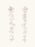 Long sterling silver drop earrings with delicate floral vine design and crystal accents on white background